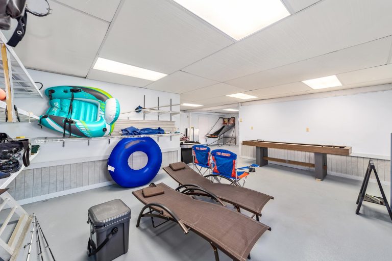 Game room with guest kayaks and shuffleboard