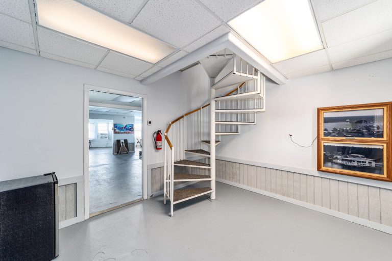 Spiral staircase connecting the game room and main floor
