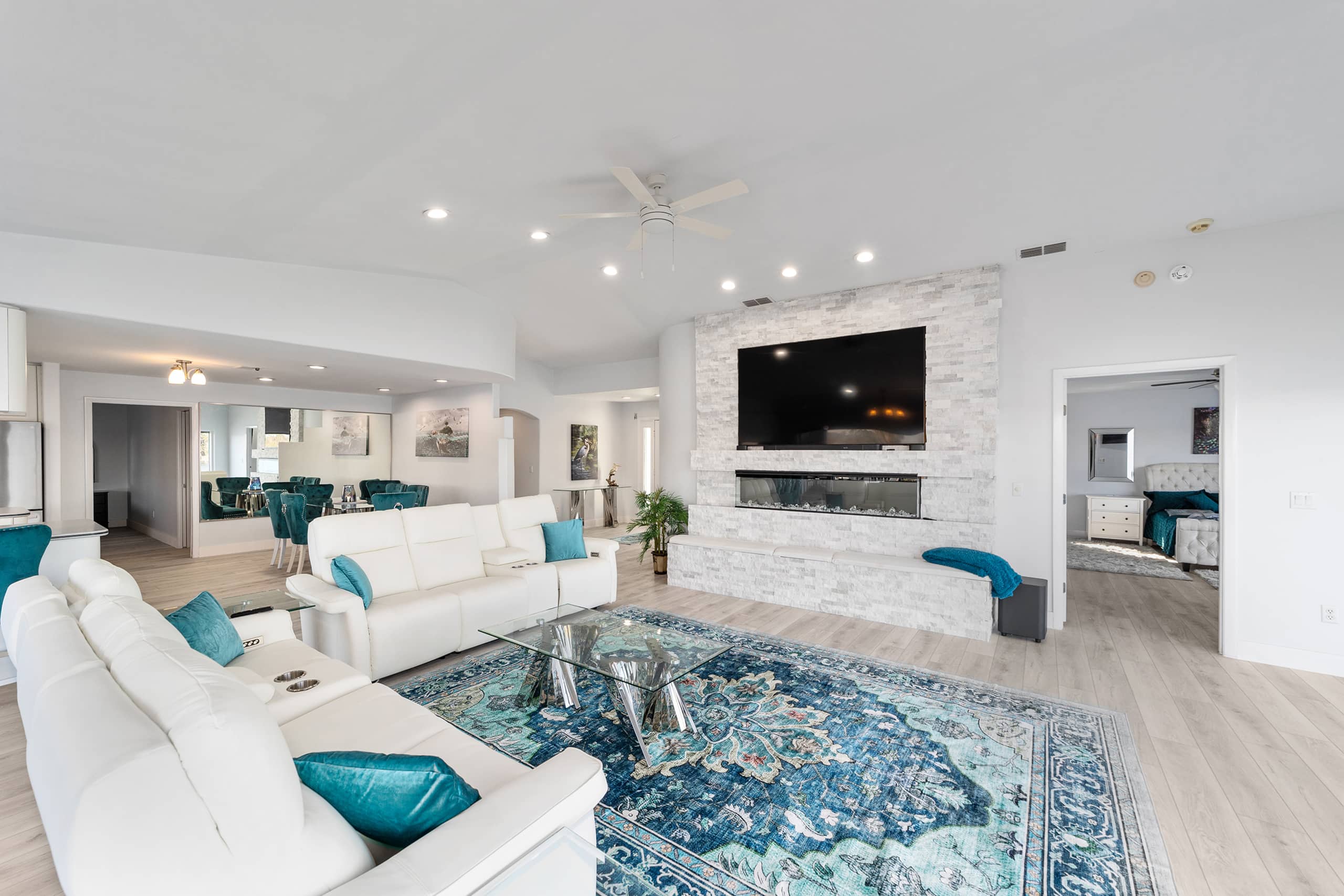 Large waterfront living room with fireplace