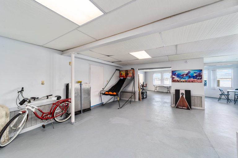 Game room with arcade games and bicycles