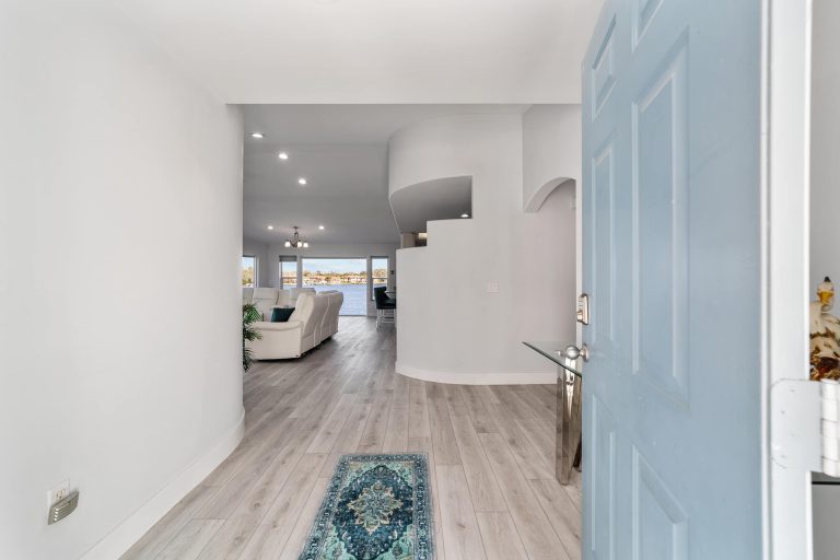 Entry hall opening into the waterfront living room